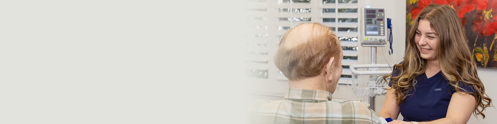 A female nurse attending to a resident